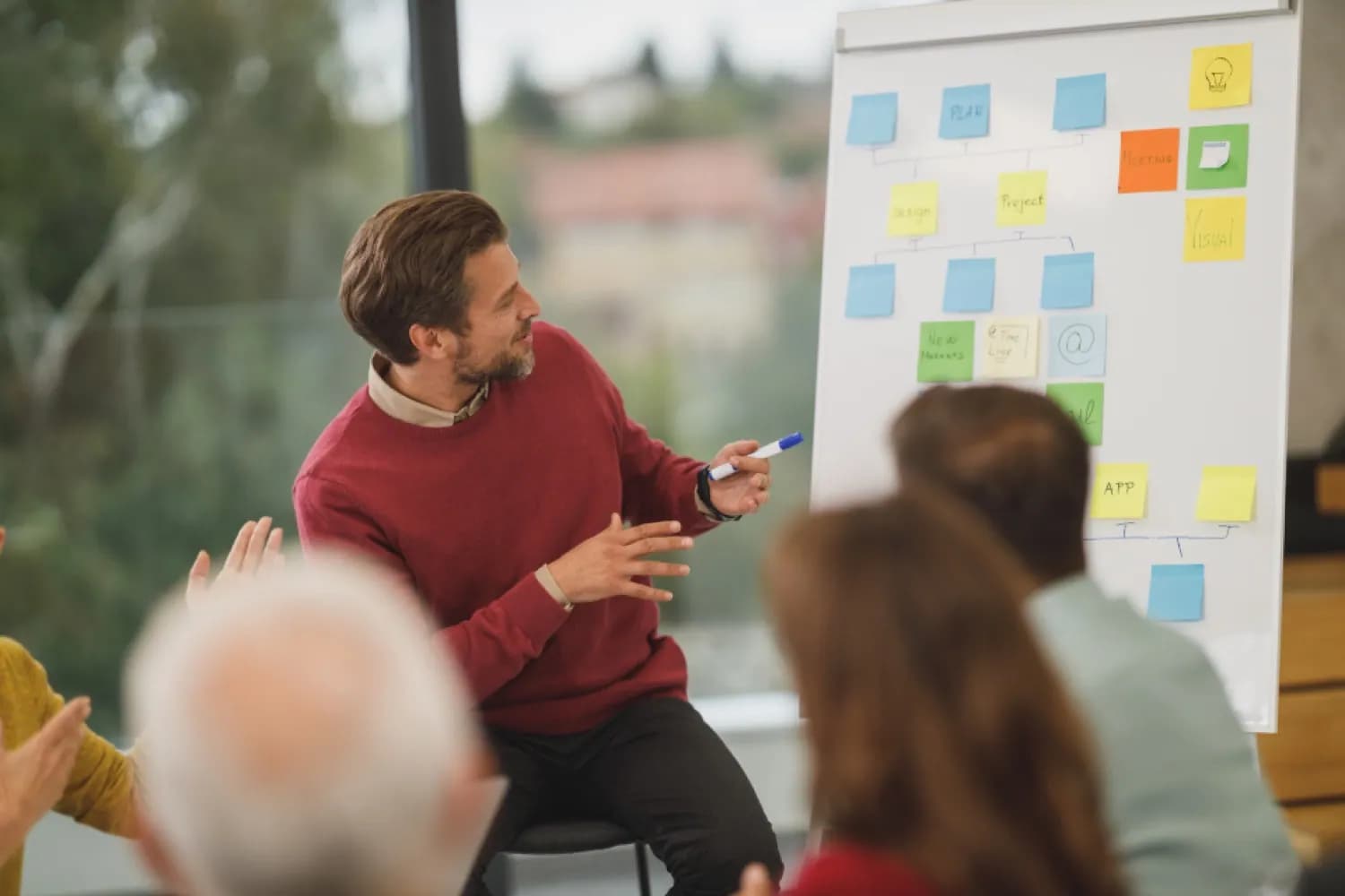 Open-plan office with teams working together, representing aligned revenue teams