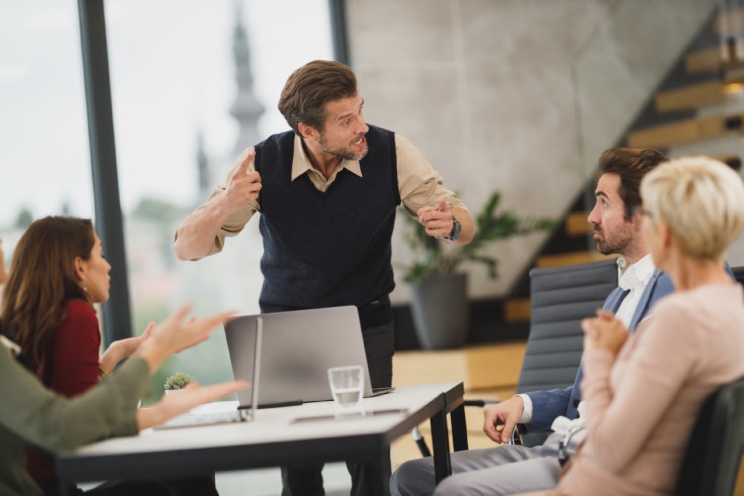 Software developers collaborating on code at a workstation